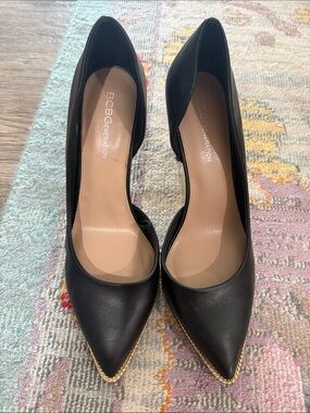 BCBGeneration Black Pointed Toe Pumps with Gold Chain Trim